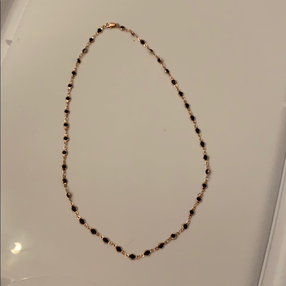 Black and rose gold colored necklace
